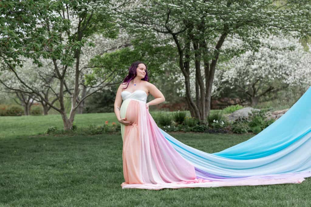 Kristina wears a white dress and the rainbow skirt.