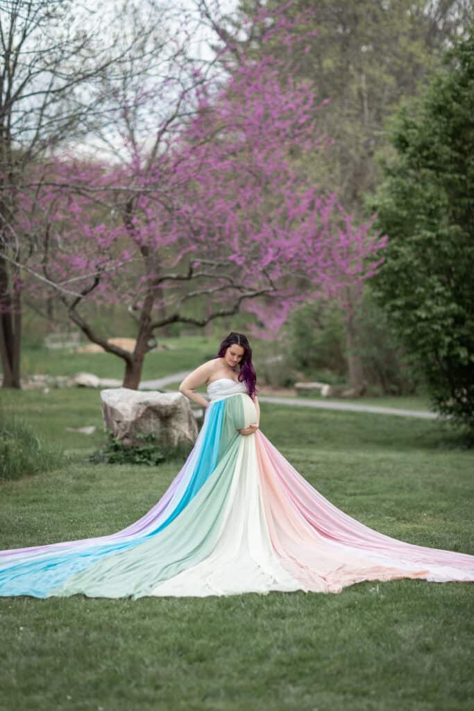 Kristina wears a white dress and the rainbow skirt.