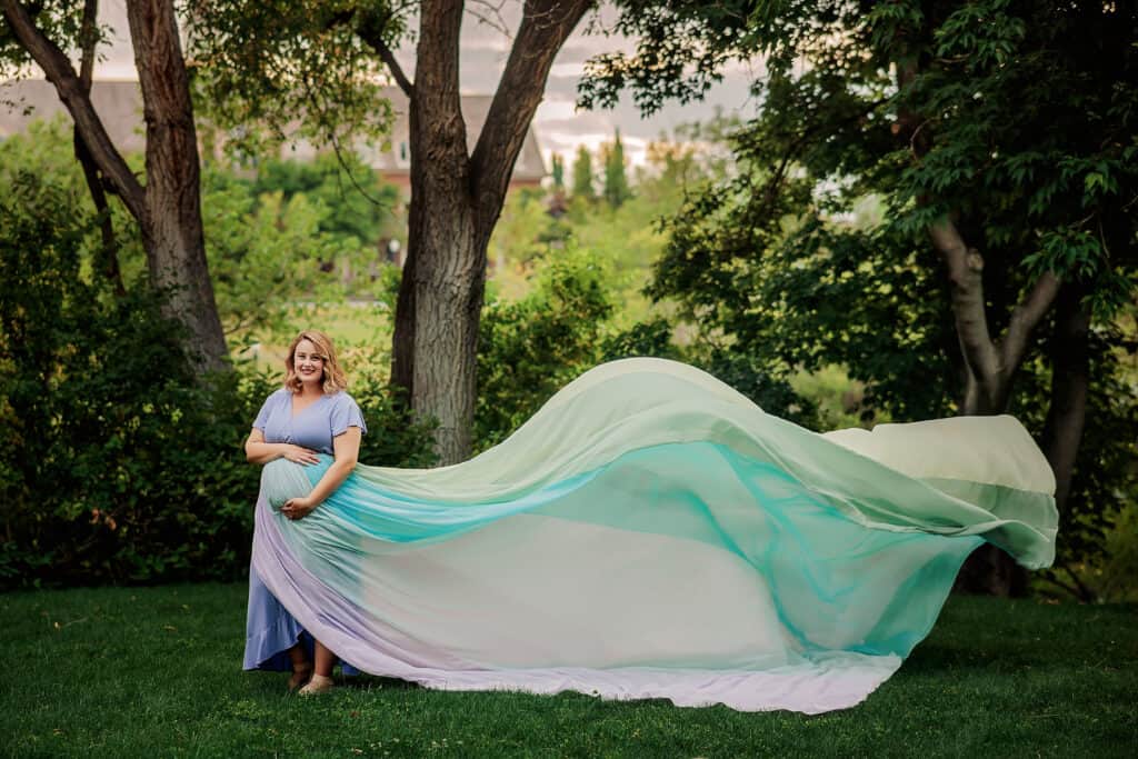 Courtney wears a blue dress and the rainbow skirt.